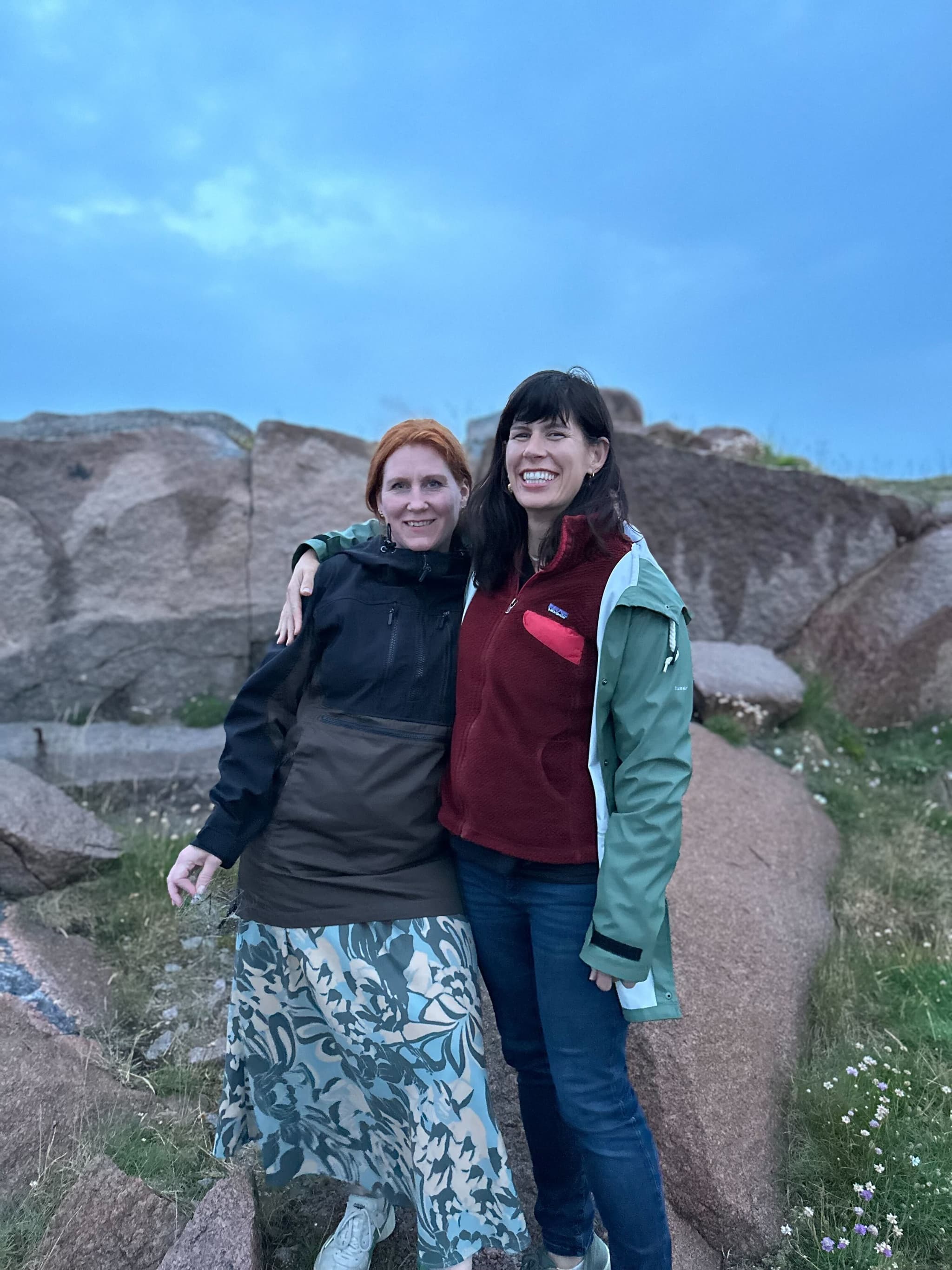 Two teammates in a rocky landscape