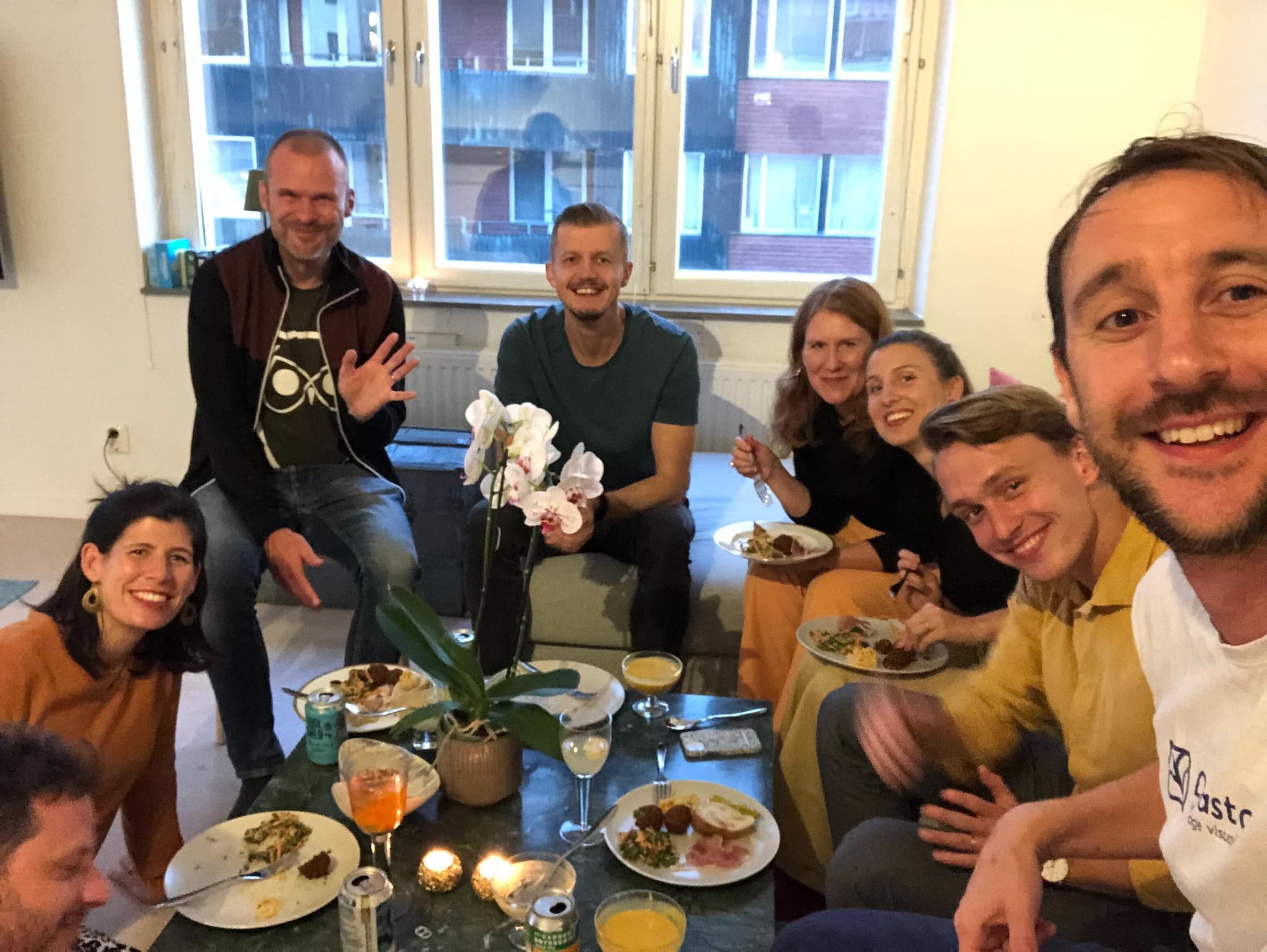 Team gathered indoors for a meal